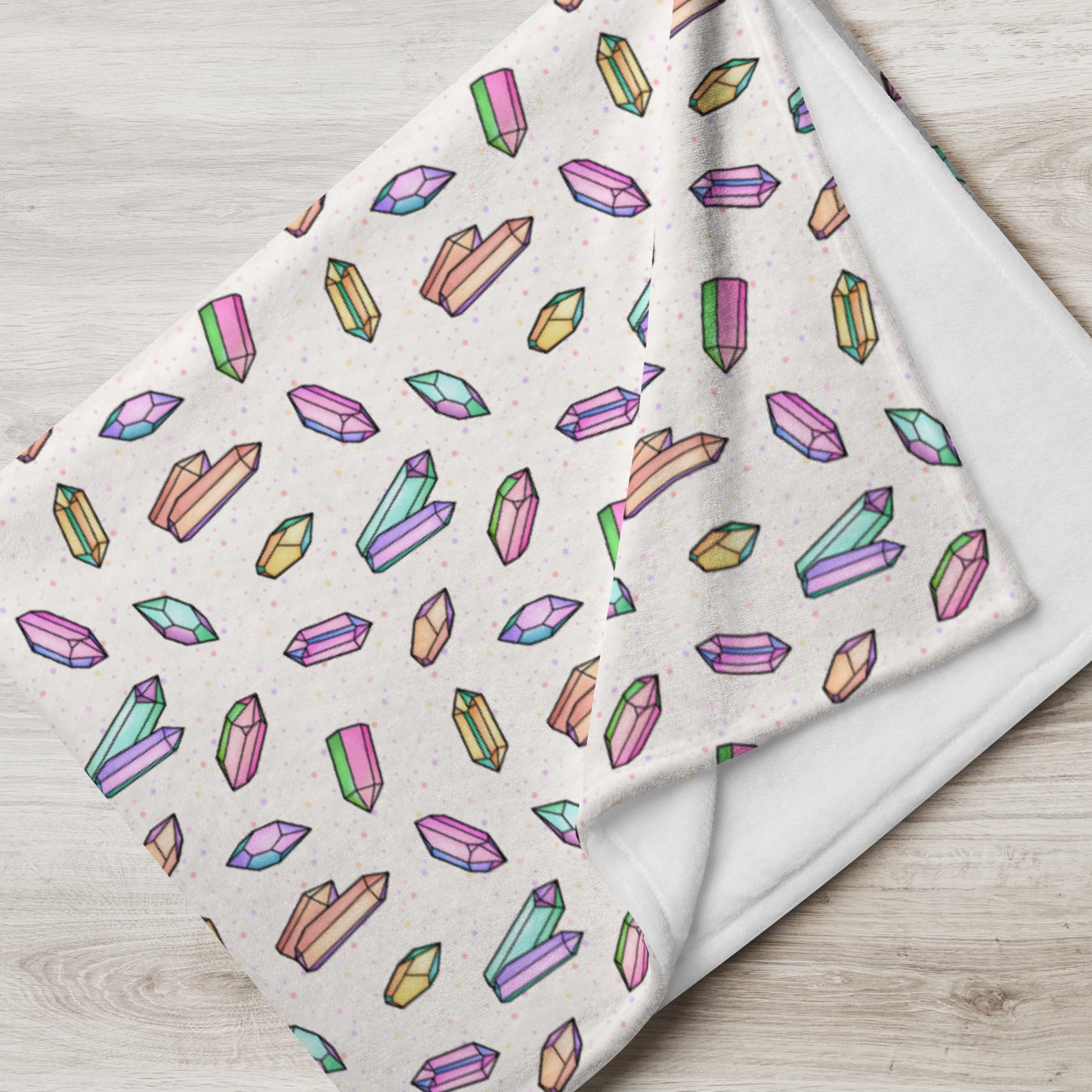 folded view of 60" x 80" Crystals most Mystical throw blanket in cream