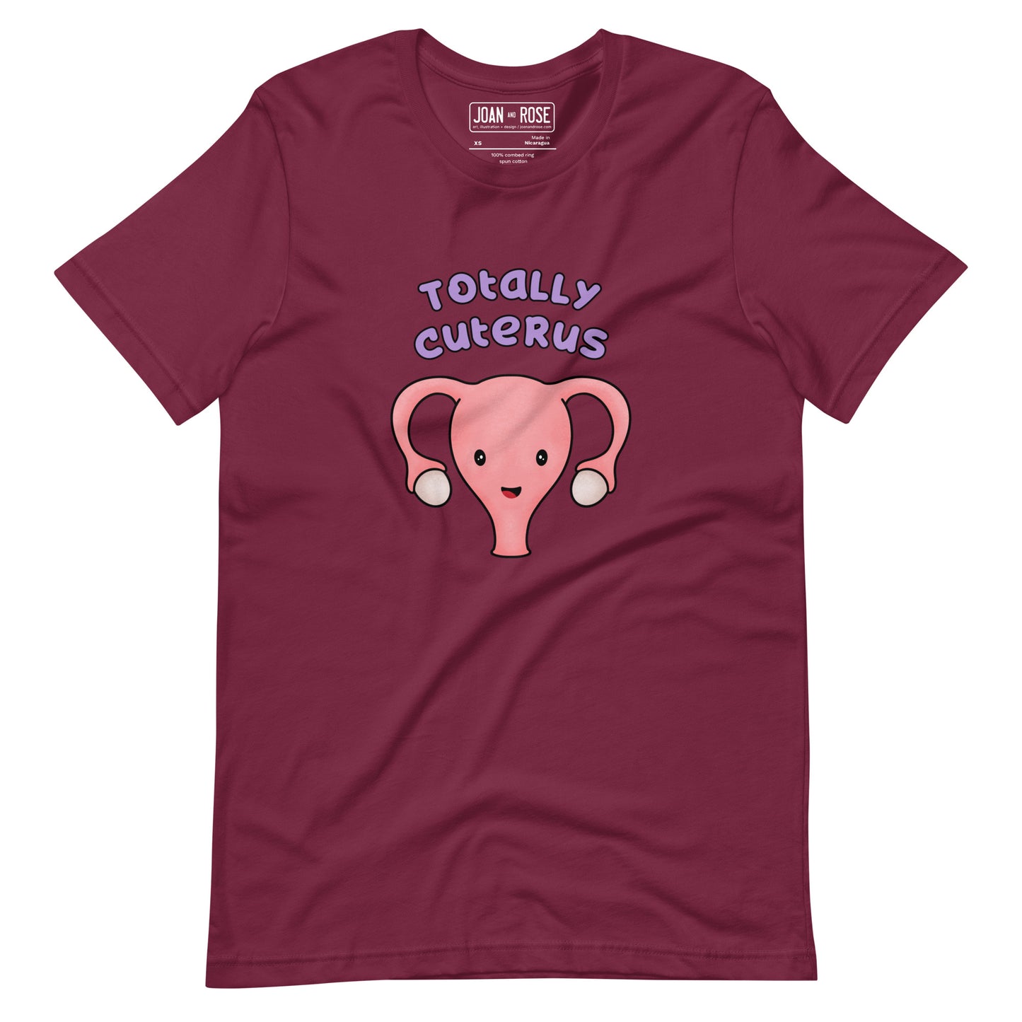 Maroon coloured t-shirt with an illustration of a cute uterus character smiling with the text in purple 'Totally Cuterus'