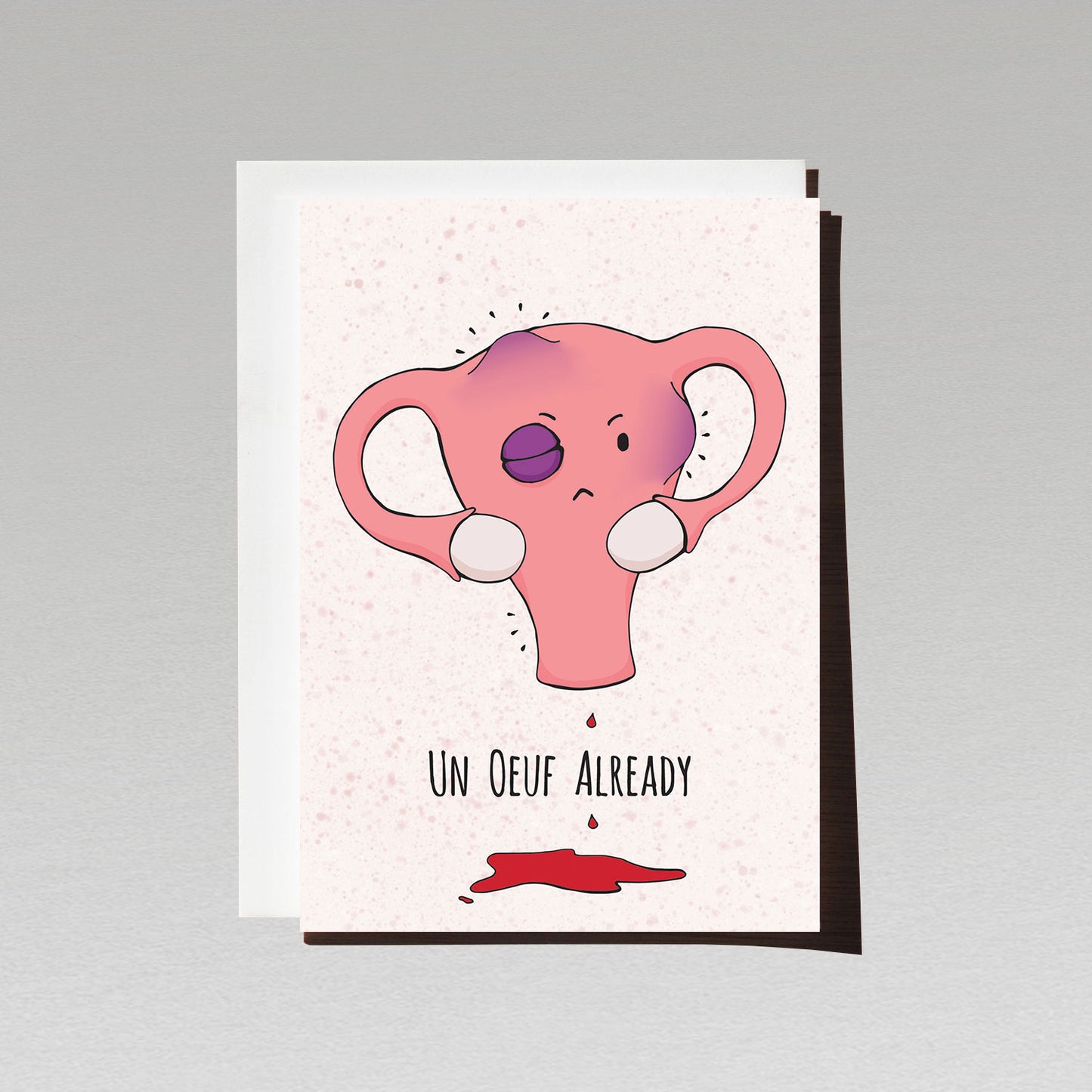 Cute Joan and Rose Uterus character feeling bruised and bleeding with text Un Oeuf Already