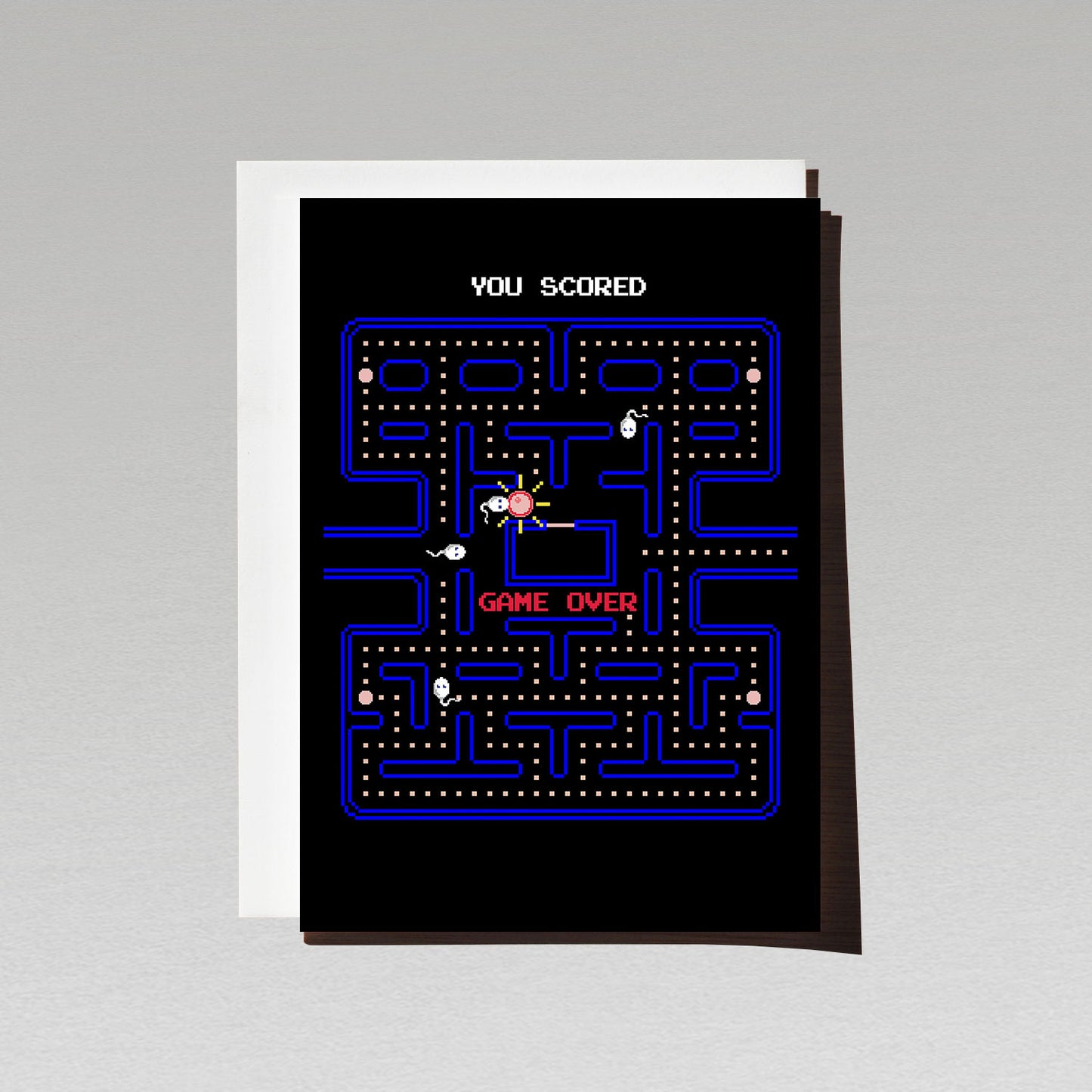 Retro 8 bit gaming pacman inspired pregnancy announcement parody greeting card with sperm chasing an egg and text Game Over