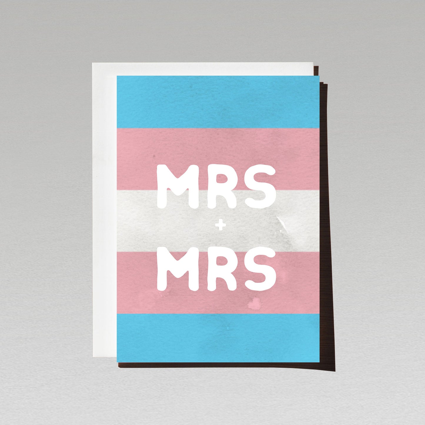 Greeting card with large white text Mrs + Mrs on LGBTQI transgender flag background