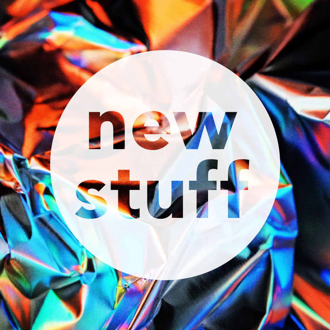 Colourful image with white circle and text 'new stuff'