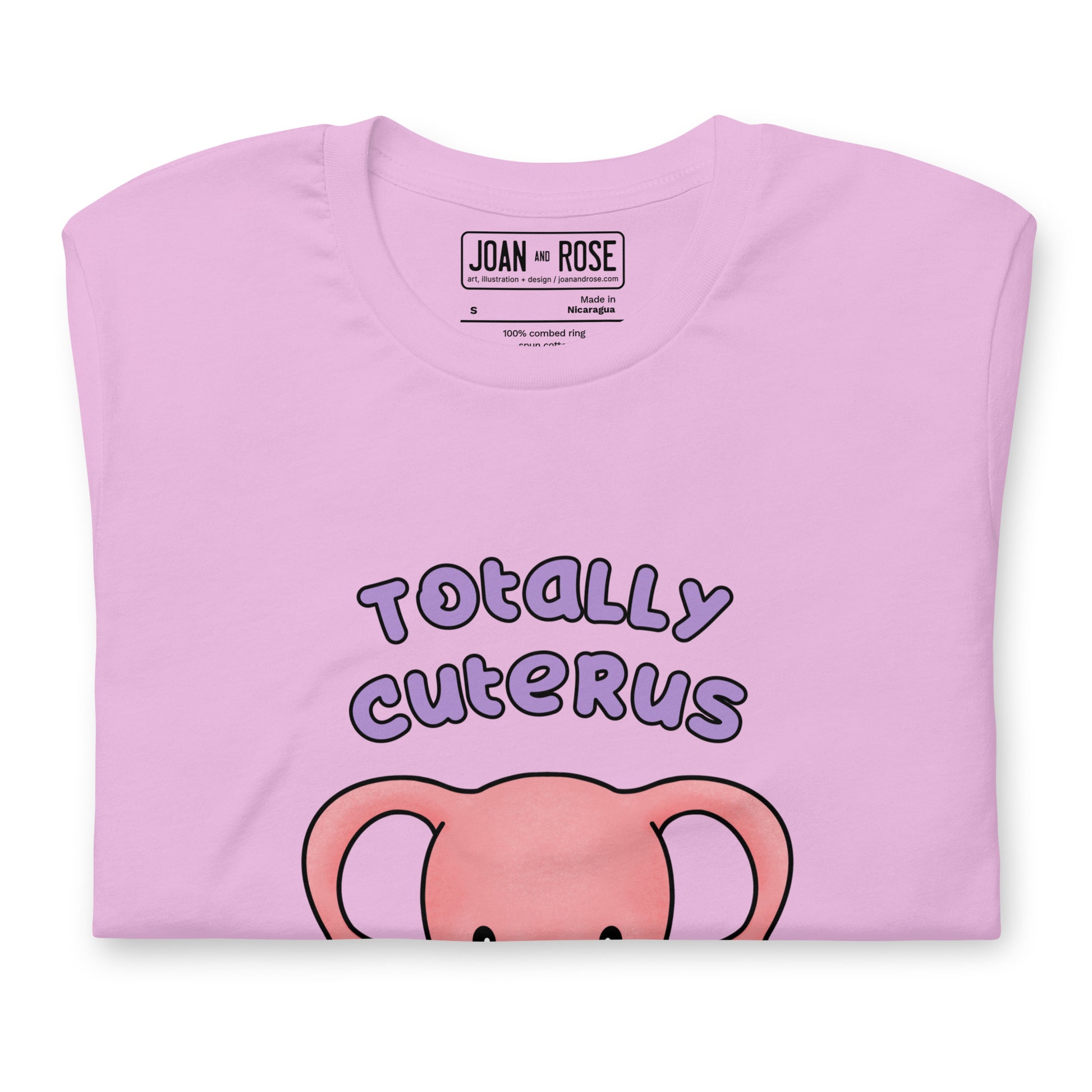 Close up of Totally Cuterus t-shirt in lilac showing inside label details