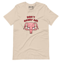 Cream coloured  t-shirt with an illustration of a cute uterus character crying with tears of blood with the text in red Don't Ovary Act