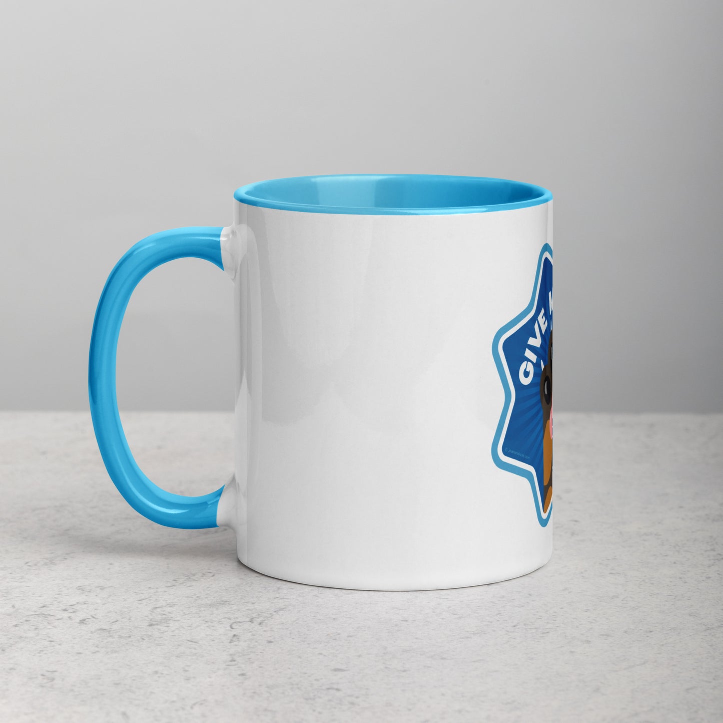 left hand facing image of a white mug with blue interior and handle. Mug has image of a tortoiseshell cats paw on a blue 8 sided star with the text 'give me four' 