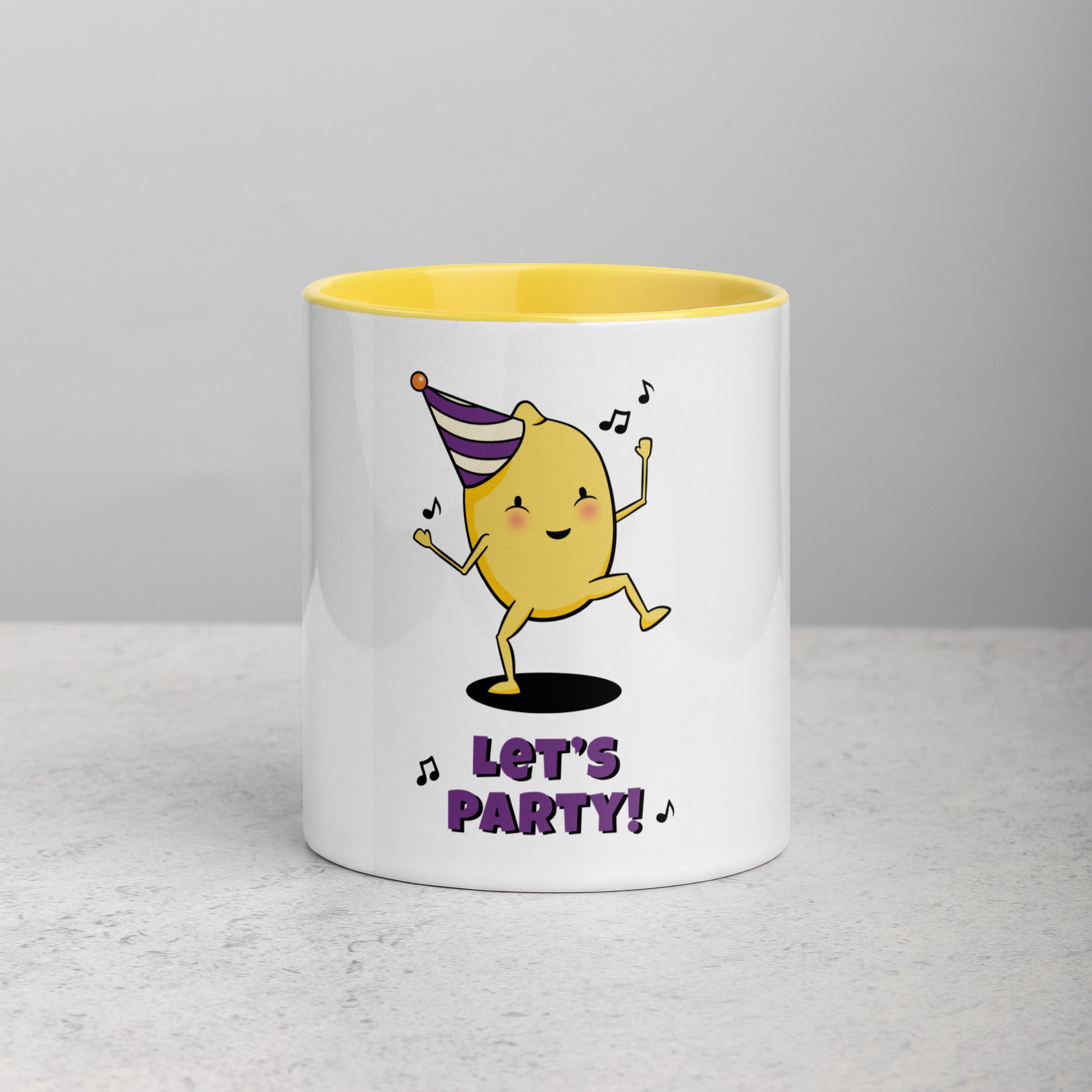 front facing white mug with yellow interior and handle. Mug has illustration of cute lemon character dancing with music notes wearing a purple and white party hat with the text Lets Party underneath it
