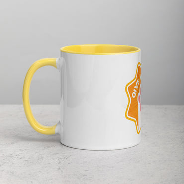 left hand facing image of a white mug with yellow interior and handle. Mug has image of a white cats paw on an orange 8 sided star with the text 'give me four' 