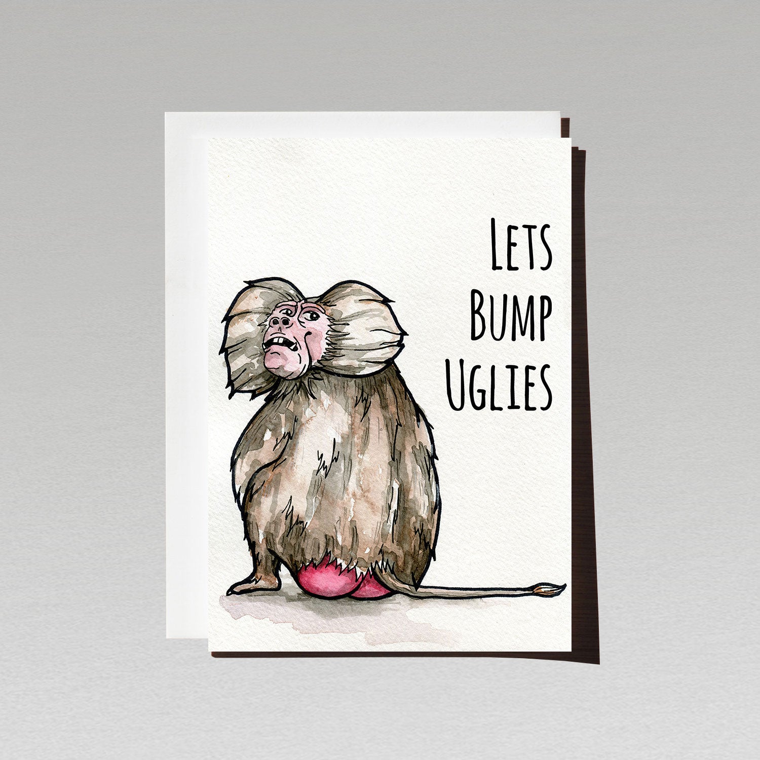 Ugly Baboon sitting with back and red bottom to front looking over its shoulder on white background with text Lets Bump Uglies