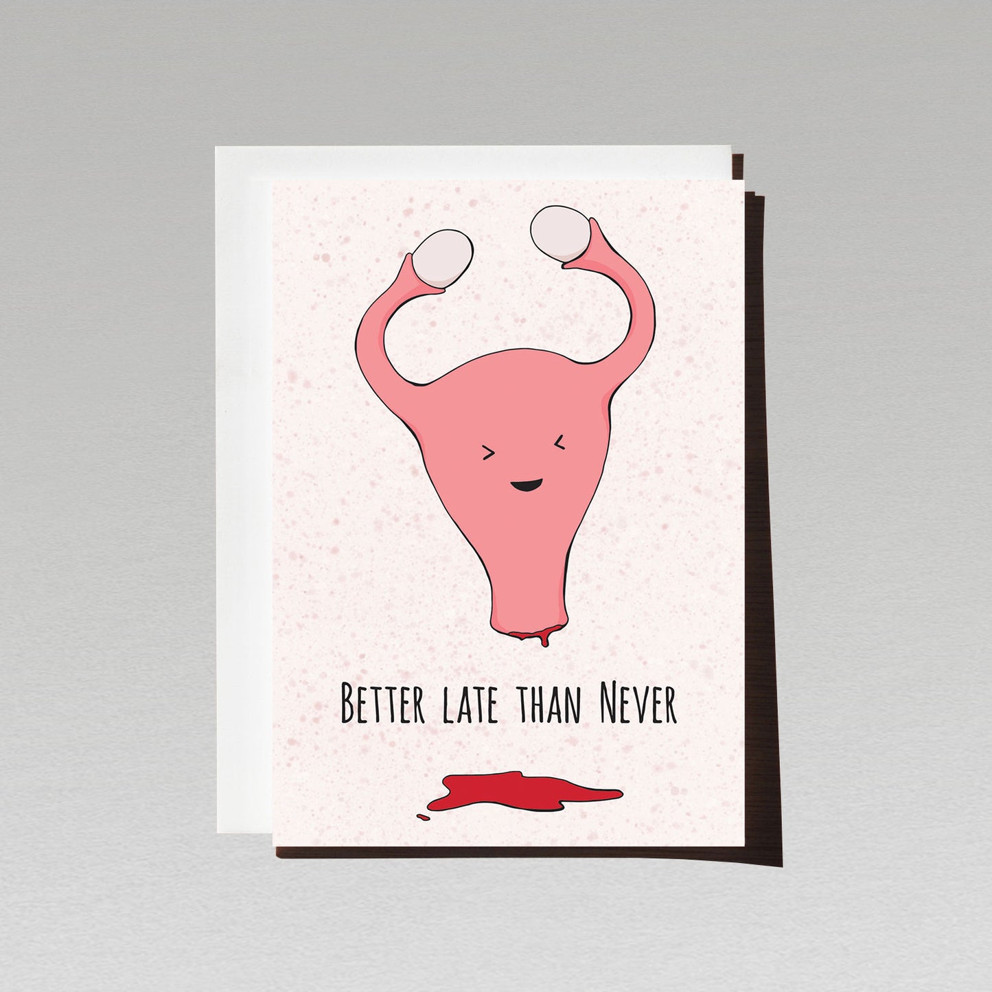 happy uterus jumps for joy with period blood puddle underneath with text better late than never