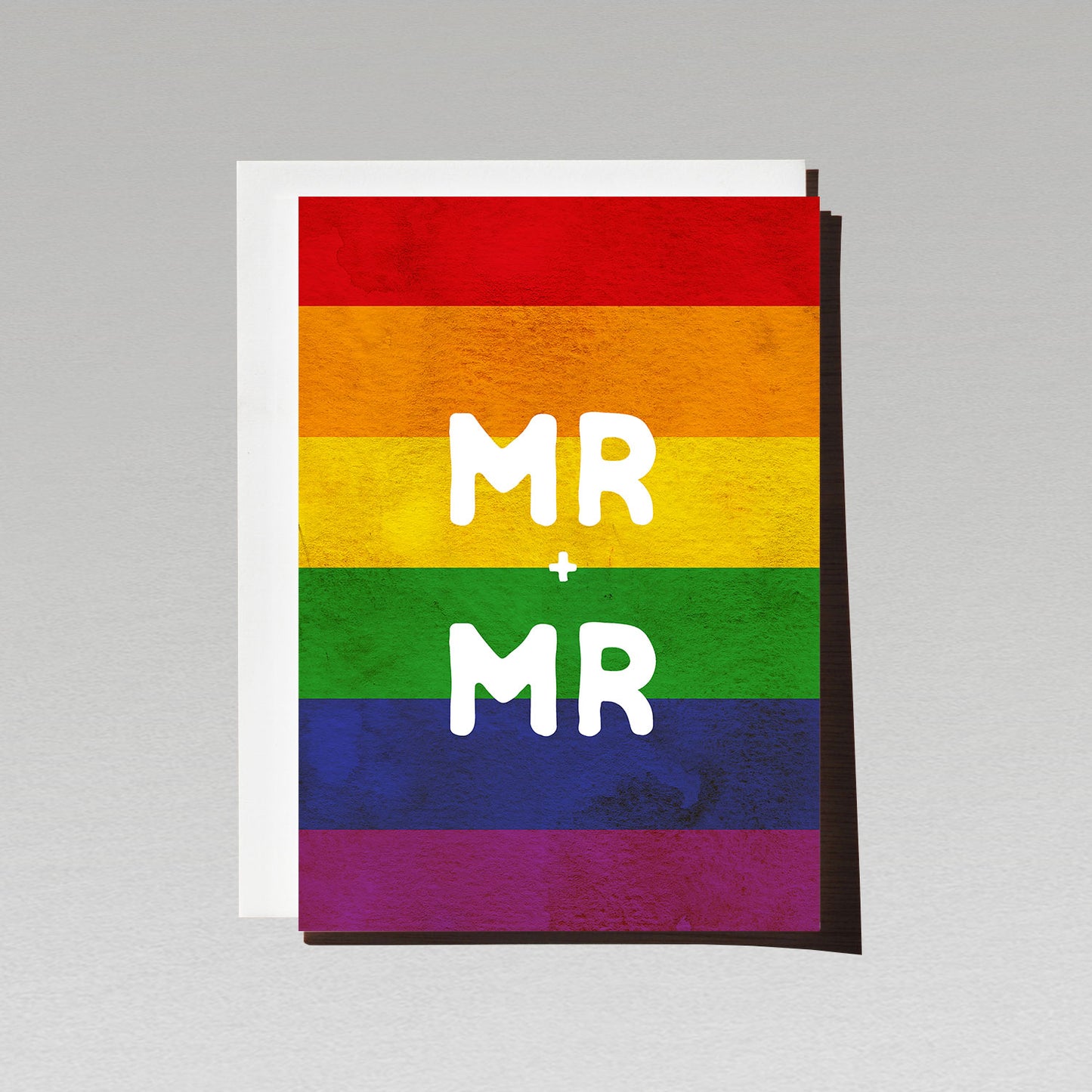 Greeting card with large white text Mr + Mr on LGBTQI rainbow flag background