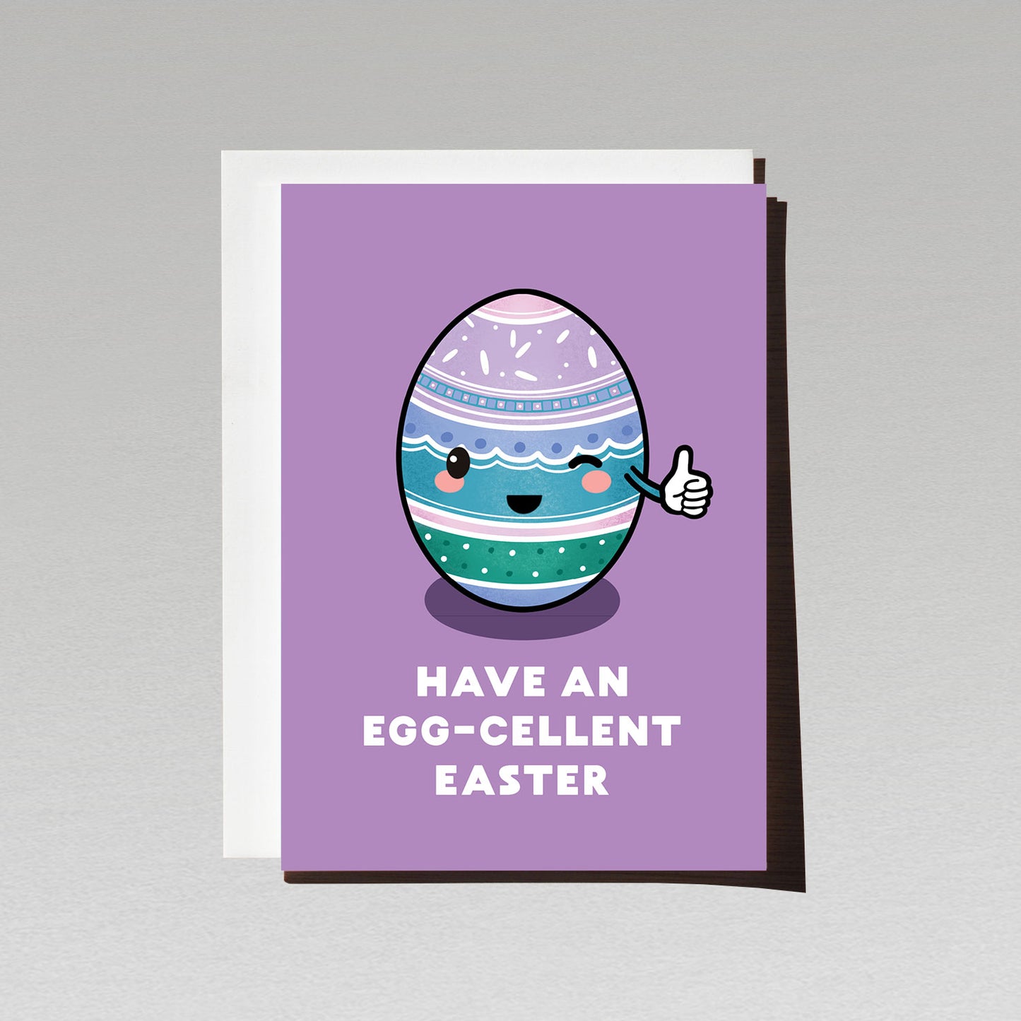 greeting card with happy cute green blue and purple easter egg smiling and giving thumbs up with text have an eggcellent easter