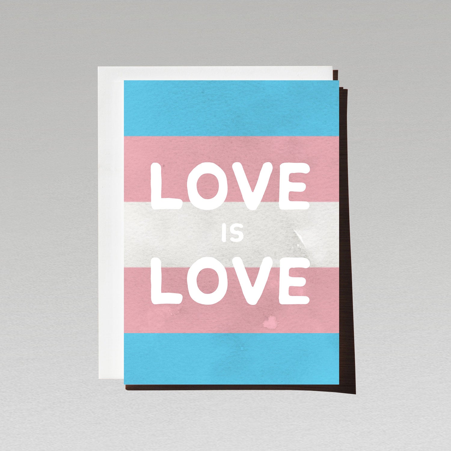 Greeting card with large white text Love is Love on LGBTQI transgender flag background