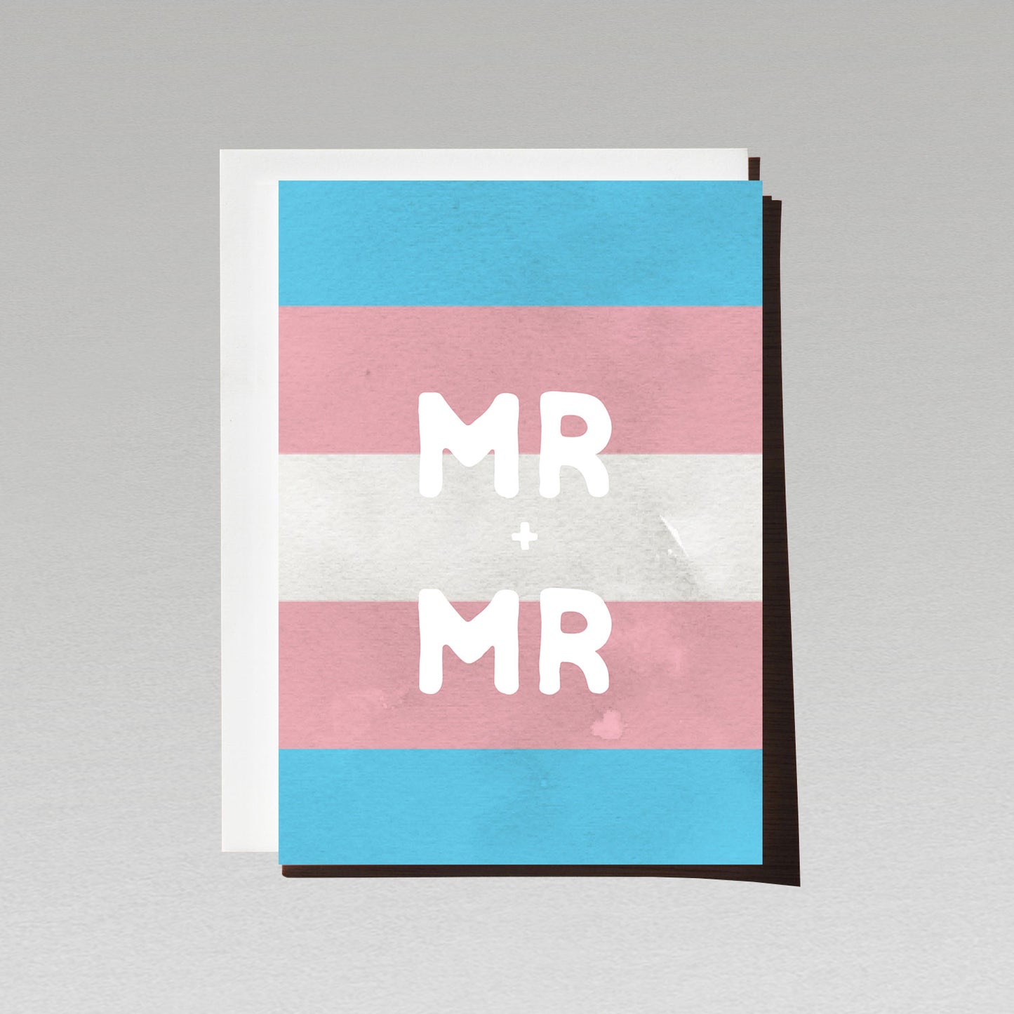 Greeting card with large white text Mr + Mr on LGBTQI transgender flag background