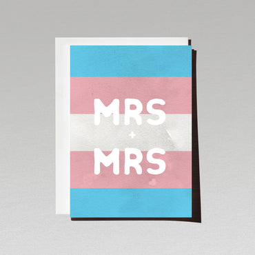 Greeting card with large white text Mrs + Mrs on LGBTQI transgender flag background